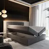 A bedroom scene with a bed with its storage compartment open. Produktbild-Vorschau