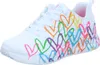 A single white sneaker with colorful heart designs printed on it. Voir les images du produit