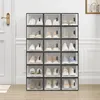 A multi-tiered shoe organizer filled with various shoes, placed against a white wall and next to a door. Náhľad obrázku produktu