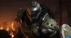 A heavily armored character stands in a fiery, post-apocalyptic environment. Produktbild-Vorschau