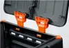 Close-up view of the open lid and top edge of a black compost bin, showing orange plastic locking mechanisms. Náhled obrázku produktu