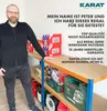 A man is standing next to a shelf unit with various items on it, including boxes and tools. Text overlays provide product information and a testimonial. Produktbild-Vorschau