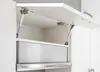 Close-up view of a kitchen cabinet with the door open, showing gas struts and a drawer. Náhled obrázku produktu