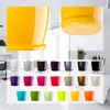 A collage of various colored flower pots with saucers, and close-ups of a yellow pot. Podgląd zdjęcia produktu