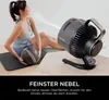 A woman is doing a workout while a fan is misting the air. Náhľad obrázku produktu