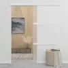 A modern interior scene featuring a sliding door, artwork, and a laundry basket. Náhľad obrázku produktu