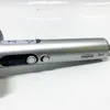 Close-up of a silver hair dryer with buttons and branding. Produktbild-Vorschau
