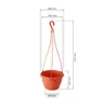 A terracotta-colored hanging planter with dimensions indicated by dashed lines and measurements. Produktbild-Vorschau