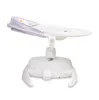 A white baby swing with a purple canopy and a patterned liner. Produktbild-Vorschau