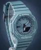 A close-up studio shot of a teal Casio G-Shock watch against a dark gray background. Produktbild-Vorschau