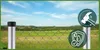 A fence post with two informational icons, set against a blurred rural landscape. Produktbild-Vorschau