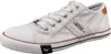 A white canvas sneaker with brown accents and navy details. Produktbild-Vorschau