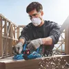 A man is using a Bosch cordless planer on a wooden beam at a construction site. Podgląd zdjęcia produktu