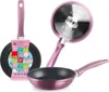 Three pink frying pans are displayed against a white background. One pan is shown from the side, another is shown from the bottom, and the third is shown from the front with a tag attached. Podgląd zdjęcia produktu
