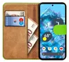 A book-style phone case with a Google Pixel 8 phone inside, showing the phone's screen and widgets, along with cards and banknotes in the case's slots. Produktbild-Vorschau