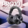 A pair of black studio headphones is displayed against a backdrop of abstract, curved shapes in shades of pink and blue. Náhled obrázku produktu