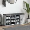 A shoe bench with storage compartments and a padded seat, placed in a hallway or entryway. Anteprima dell’immagine prodotto