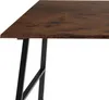 A close-up view of a desk's wooden surface and black metal legs. Náhled obrázku produktu