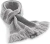 A knitted scarf with fringe on a white background. Produktbild-Vorschau