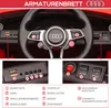 Close-up view of the dashboard and steering wheel of a red children's electric car, with numbered labels pointing to various features and controls. Produktbild-Vorschau