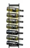 A black metal wine rack mounted on a white wall, holding seven bottles of wine. Náhled obrázku produktu