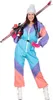 A woman wearing a colorful ski suit and holding skis. Produktbild-Vorschau