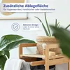 A close-up view of a bamboo shelf unit with plants and bathroom accessories. Produktbild-Vorschau