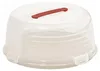 A clear plastic cake carrier with a red handle on top. Voir les images du produit
