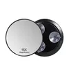 A round magnifying mirror with suction cups on a white background. Produktbild-Vorschau