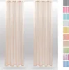 Two sheer beige curtains hanging side-by-side, with a strip of different colored fabric swatches on the right side. Anteprima dell’immagine prodotto