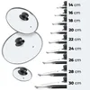 A size chart showing different sizes of glass lids with metal rims, with corresponding measurements in centimeters. Podgląd zdjęcia produktu