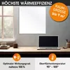 A white infrared heating panel is mounted on a wall above a desk with a laptop and coffee cups. Produktbild-Vorschau