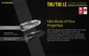 A marketing image showcasing two Nitecore TIKI/TIKI LE keychain lights against a dark background, with descriptive text and logos. Podgląd zdjęcia produktu
