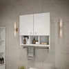 A white bathroom cabinet with two doors and open shelves below, mounted on a tiled wall. A towel hangs from a bar beneath the shelves. Produktbild-Vorschau