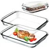 Two glass baking dishes, one with a steak and garnishes, the other empty, with a third dish containing grilled meat and a lid stacked on top. Anteprima dell’immagine prodotto