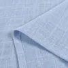 A close-up view of light blue fabric with a linen texture. Produktbild-Vorschau