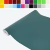 A roll of teal colored vinyl wrap is shown diagonally against a white background. Produktbild-Vorschau