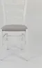 A white wooden chair with a gray upholstered seat is shown against a plain white background. Voir les images du produit