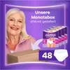 A woman is smiling next to a box of Always Discreet incontinence slips, with a graphic showing the product and quantity. Podgląd zdjęcia produktu