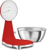 A red kitchen scale with a silver bowl next to it, on a white background. Náhľad obrázku produktu