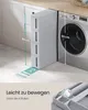 A narrow storage unit with four drawers is placed next to a washing machine, with dimensions indicated. Produktbild-Vorschau