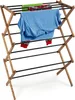 A wooden drying rack with clothes hanging on it. Anteprima dell’immagine prodotto