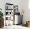 A storage cabinet and shelving unit in a garage or utility room. Voir les images du produit