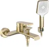 A gold-colored bathtub faucet and showerhead set against a white background. Produktbild-Vorschau