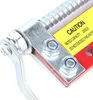 A close-up view of a mechanical device, likely a motor balancer, with a caution label. Podgląd zdjęcia produktu