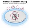 Marketing image showing a wireless charger with icons indicating foreign object detection, specifically showing keys as an example of a metallic foreign object that should not be placed on the charger. Produktbild-Vorschau