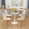 A dining set with a round white table and four white chairs in a kitchen setting. Anteprima dell’immagine prodotto