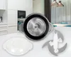 A kitchen scene with a food processor bowl, lid, and blades in the foreground. Anteprima dell’immagine prodotto