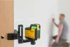 A man is using a laser level to mark a wall in a room. Produktbild-Vorschau