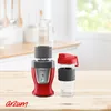 A red Arzum personal blender with two clear cups is displayed on a wooden table in a bright kitchen setting. Produktbild-Vorschau